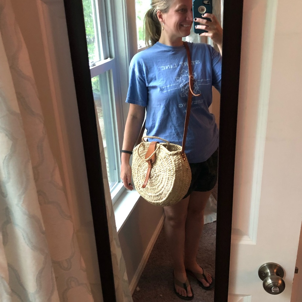 Round straw purse with faux leather strap
